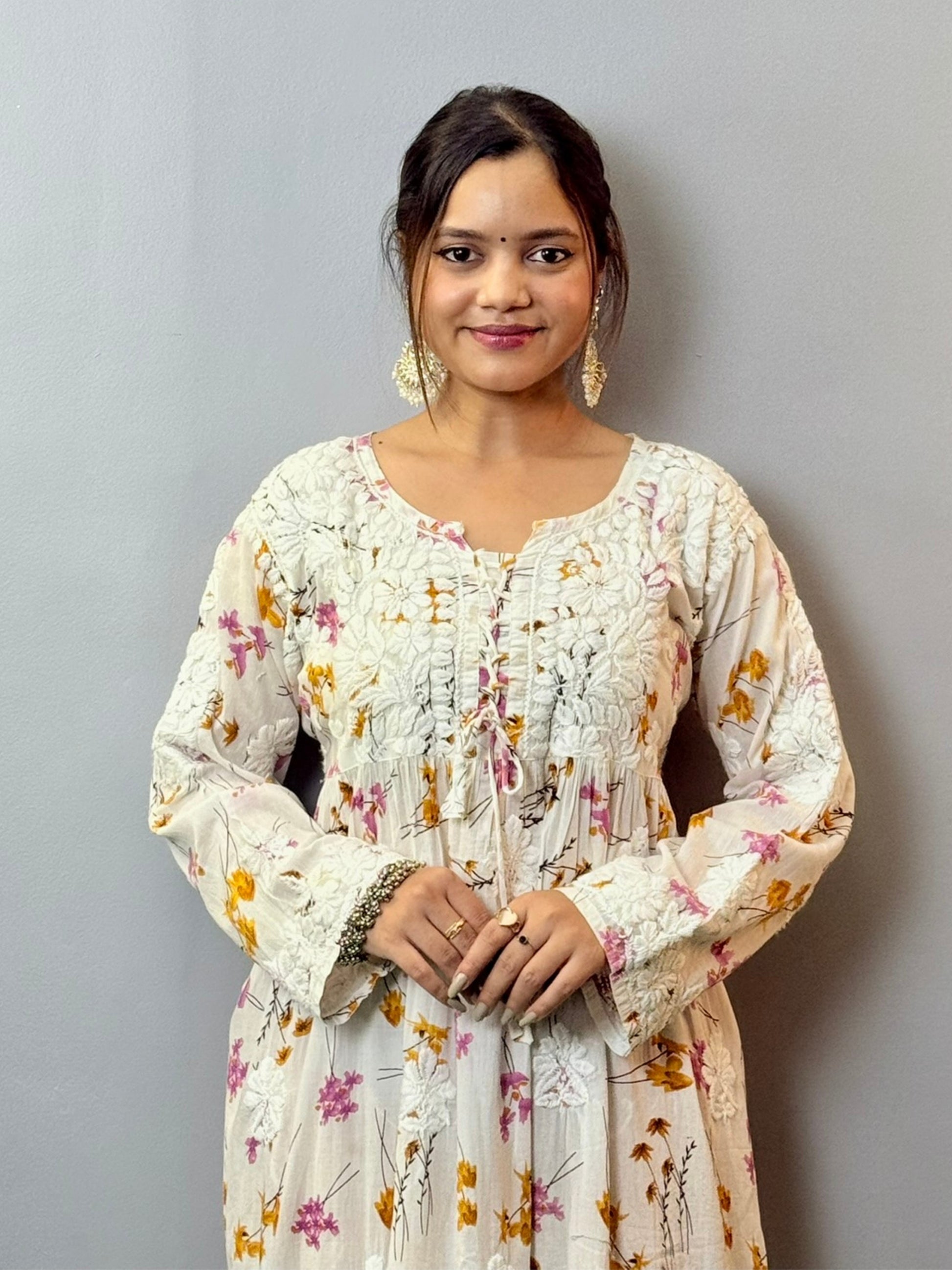 Floral printed mulmul Chikankari frock with 3D hand embroidery in off-white, pink, and yellow tones
