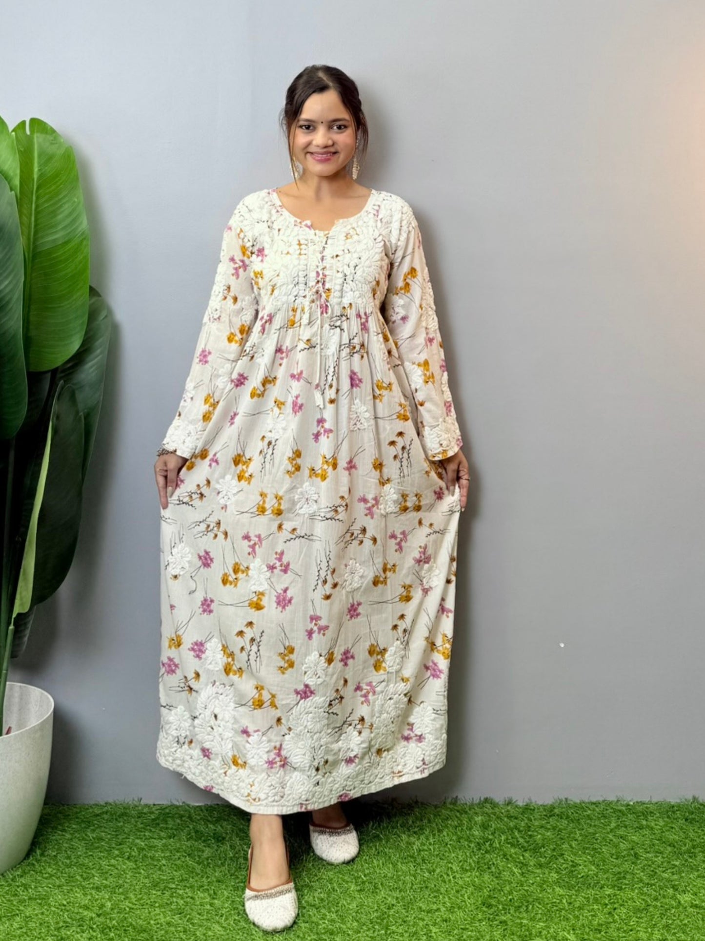 Floral printed mulmul Chikankari frock with 3D hand embroidery in off-white, pink, and yellow tones