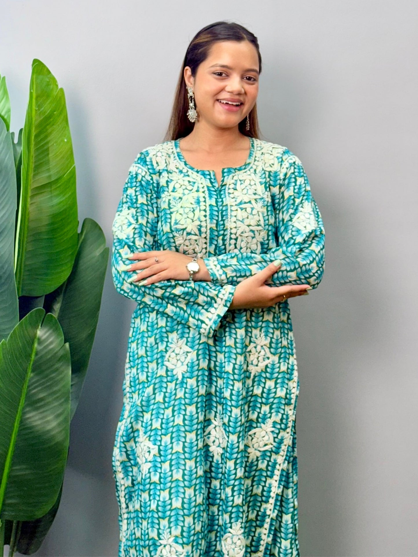 Model wearing teal green printed mulmul kurta with white chikankari hand embroidery