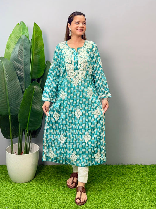 Model wearing teal green printed mulmul kurta with white chikankari hand embroidery