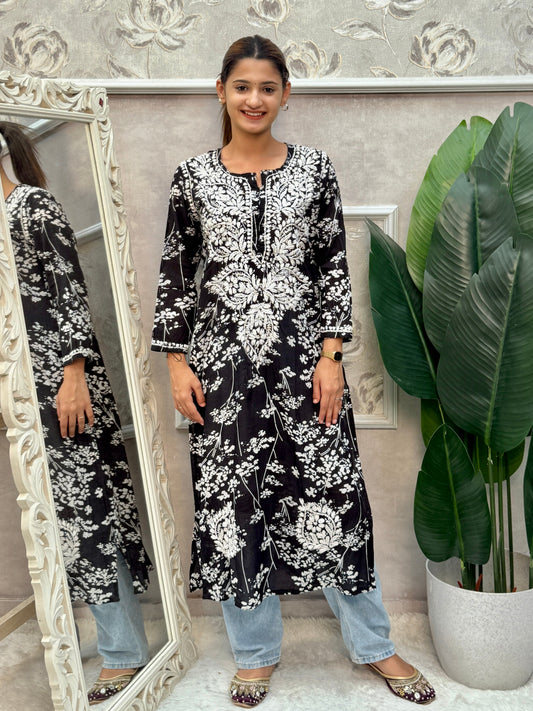 Black printed mulmul Lucknow Chikankari kurta with white floral embroidery.