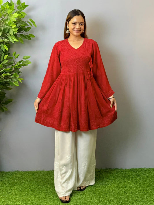 Model wearing dark red angrakha-style short chikankari kurta in viscose fabric