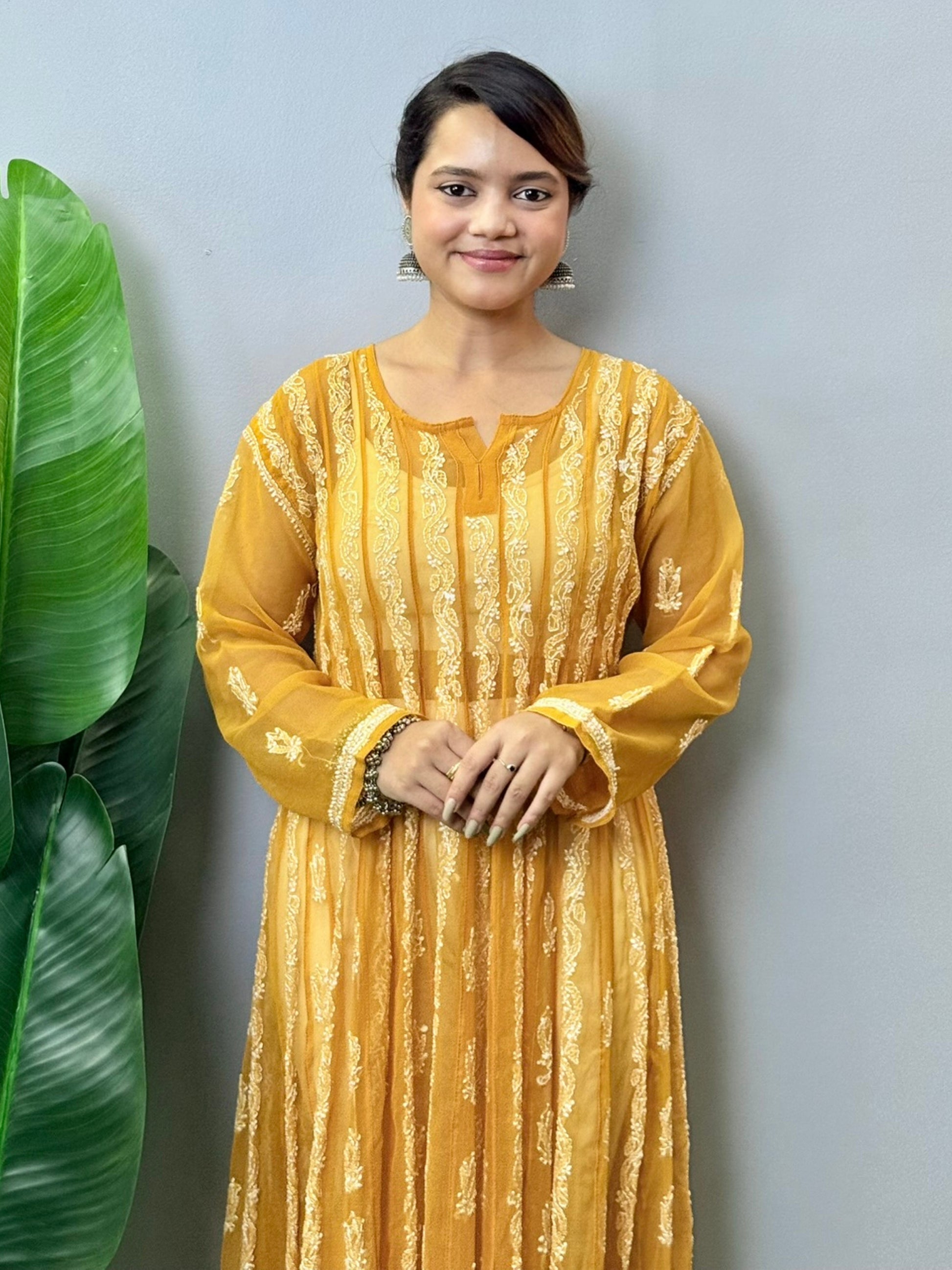 Sunshine yellow georgette long frock with heavy flair and white Lucknowi Chikankari embroidery – festive ethnic wear