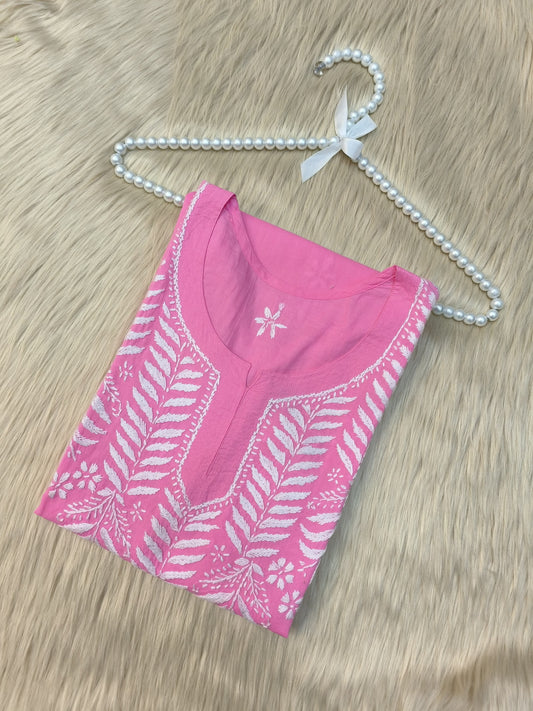 Flat lay of pink cotton chikankari kurta with white hand embroidery