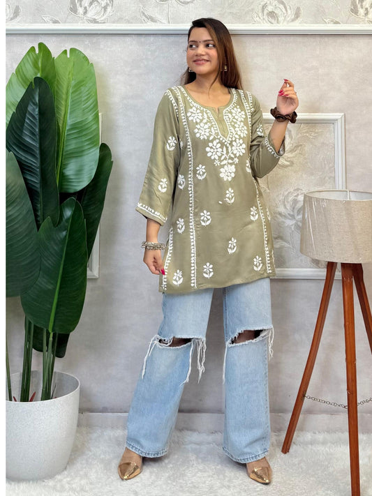 Olive green satin Lucknow Chikankari short kurta with white hand embroidery, full sleeves, and elegant floral patterns.