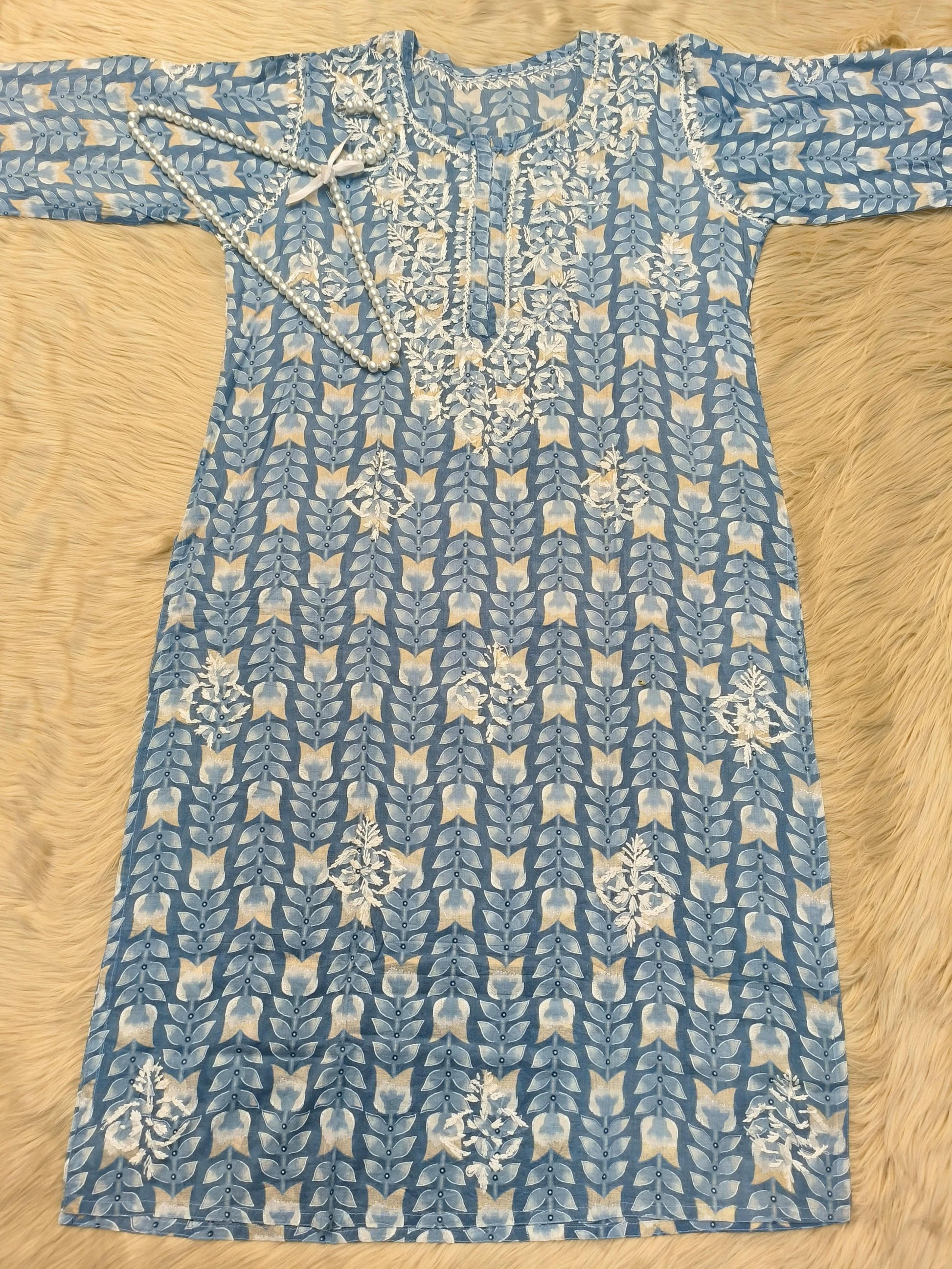 Flat lay of powder blue printed mulmul chikankari kurta with hand embroidery