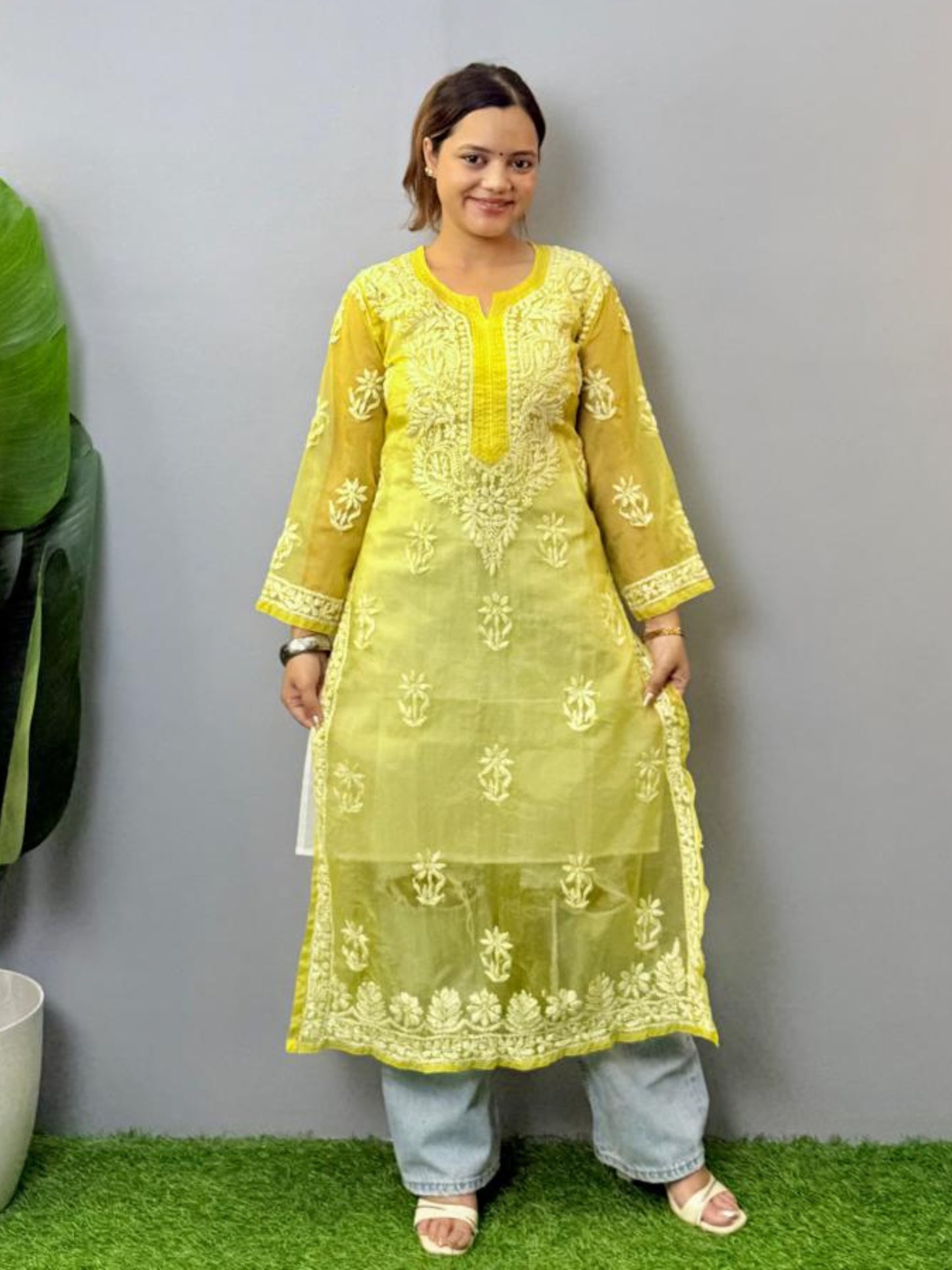 Lemon yellow sheer organza chikankari kurta with hand embroidery in white thread