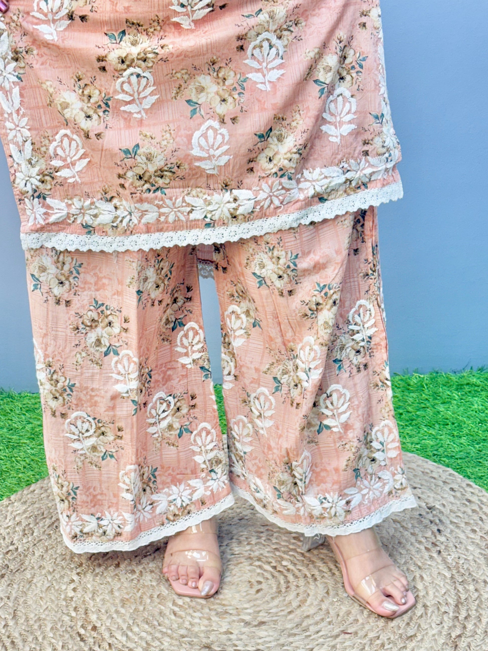 Warm peach printed Lucknow Chikankari mulmul kurta palazzo set with lace detailing