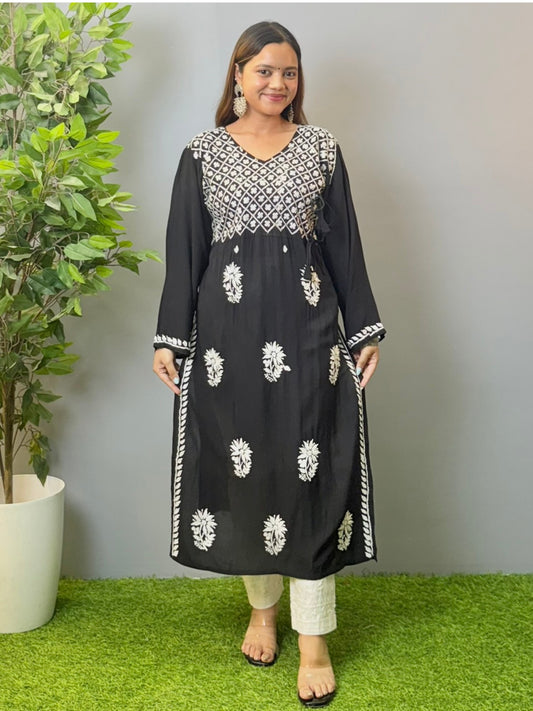 Model wearing a black modal angrakha kurta with elegant white chikankari embroidery and straight silhouette.