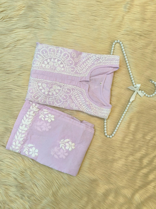 Lavender cotton chikankari kurta and palazzo set with hand embroidery, laid flat on fur background