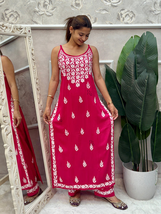 Rani pink sleeveless Lucknow Chikankari rayon kurta and pant set with white hand embroidery.