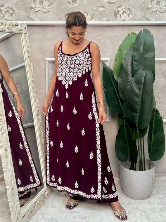 Wine sleeveless Lucknow Chikankari rayon kurta and pant set with white hand embroidery.