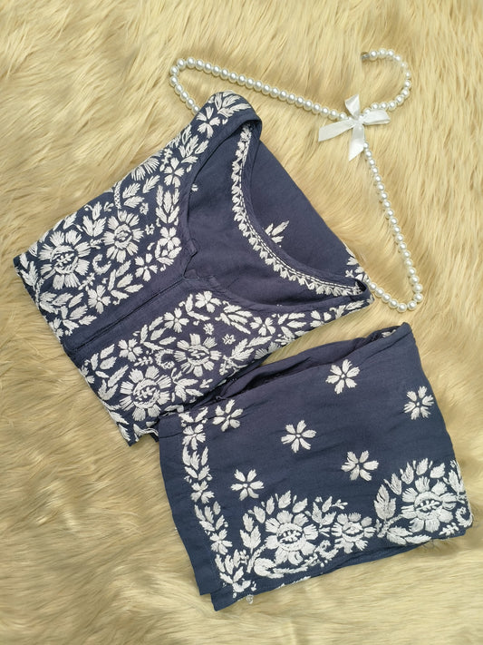 Indigo blue rayon chikankari kurta and pant set with white floral embroidery displayed on fur background