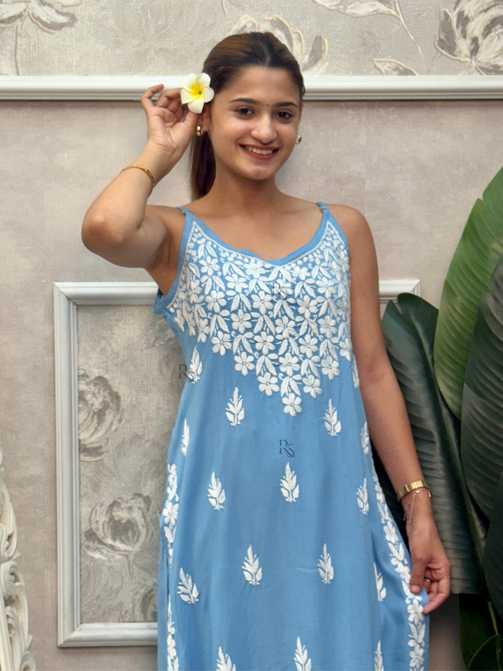 Sky blue sleeveless Lucknow Chikankari rayon kurta and pant set with white hand embroidery.