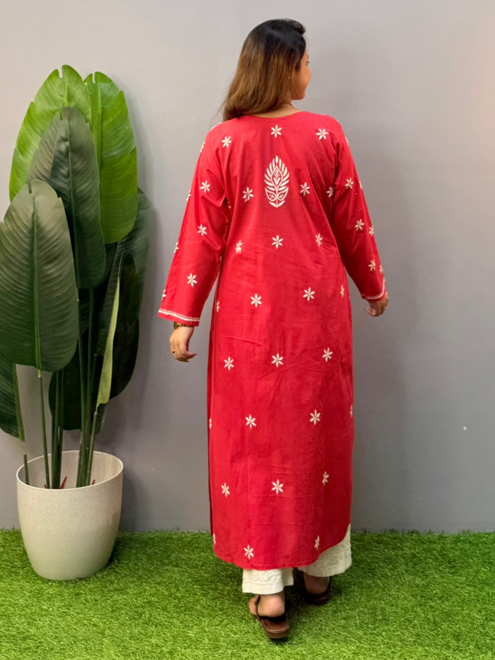 Model wearing a premium red cotton Lucknowi chikankari kurta with white hand embroidery