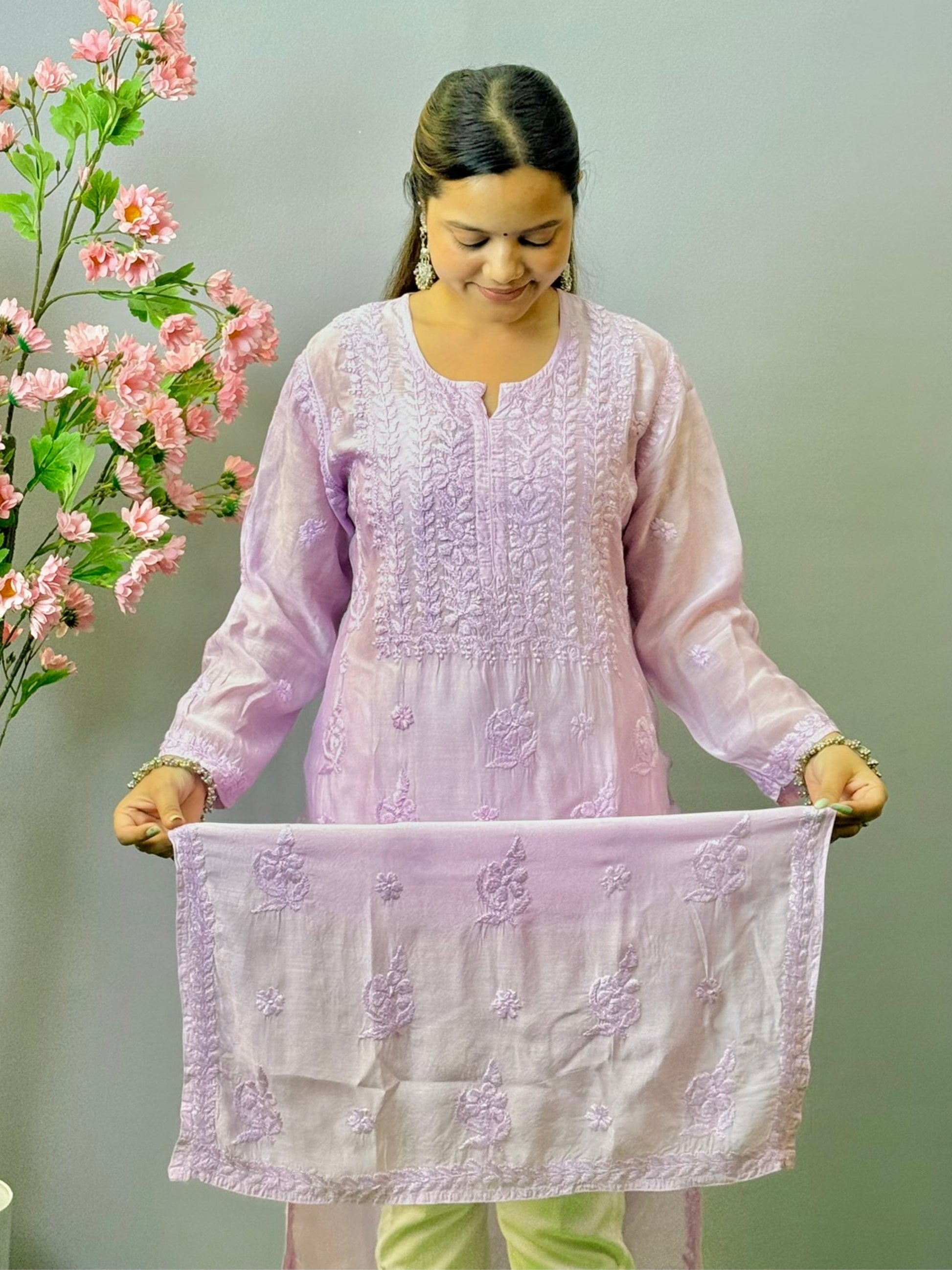 Woman wearing lilac muslin Lucknow chikankari kurta with hand embroidery