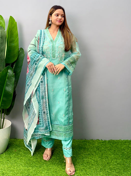 Model wearing a mint green organza kurta with rayon pants and printed cotton dupatta – Designer Wear Collection.