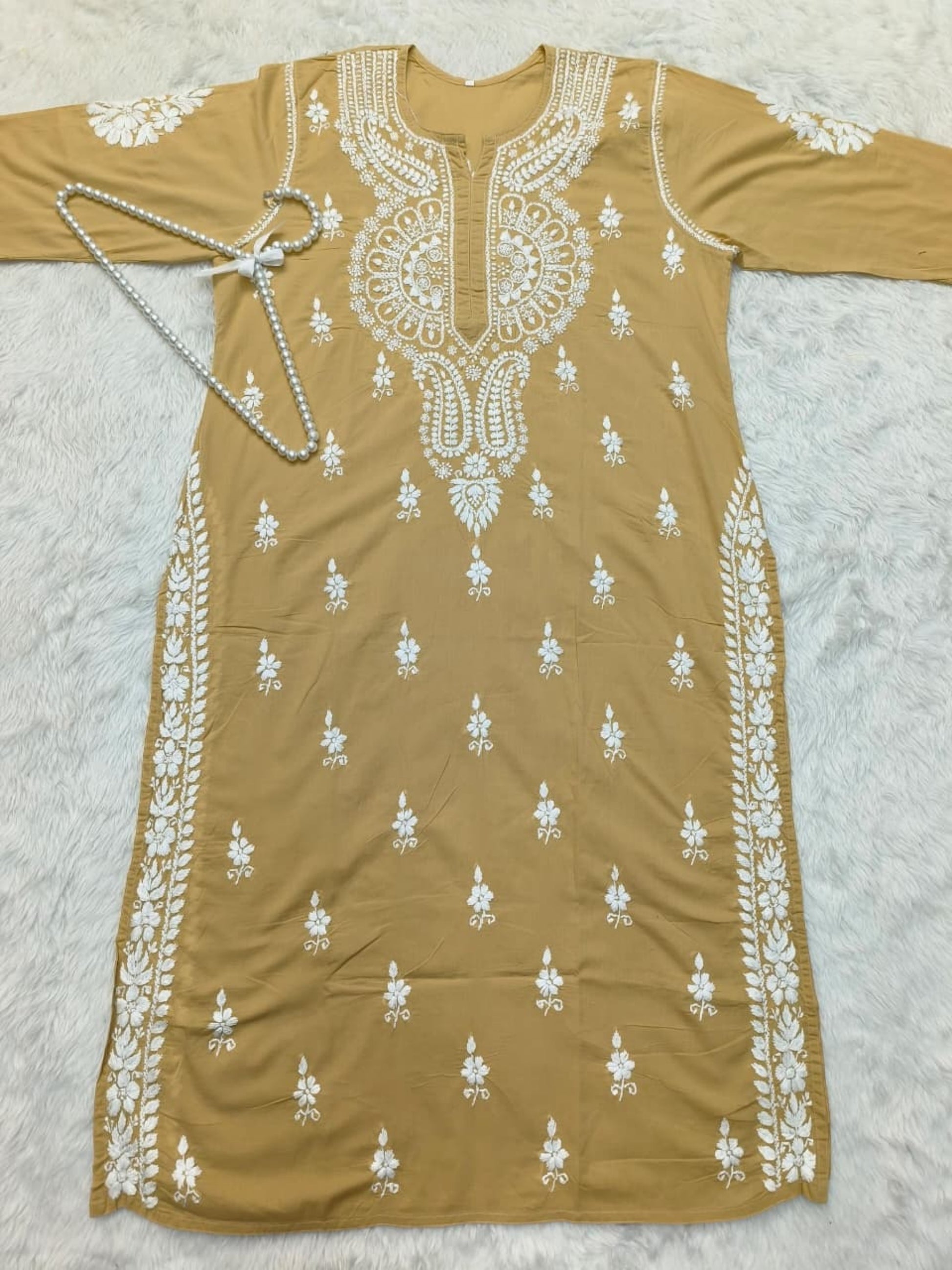 Camel brown cotton Lucknow Chikankari kurta with matching palazzo set, hand-embroidered in white thread.