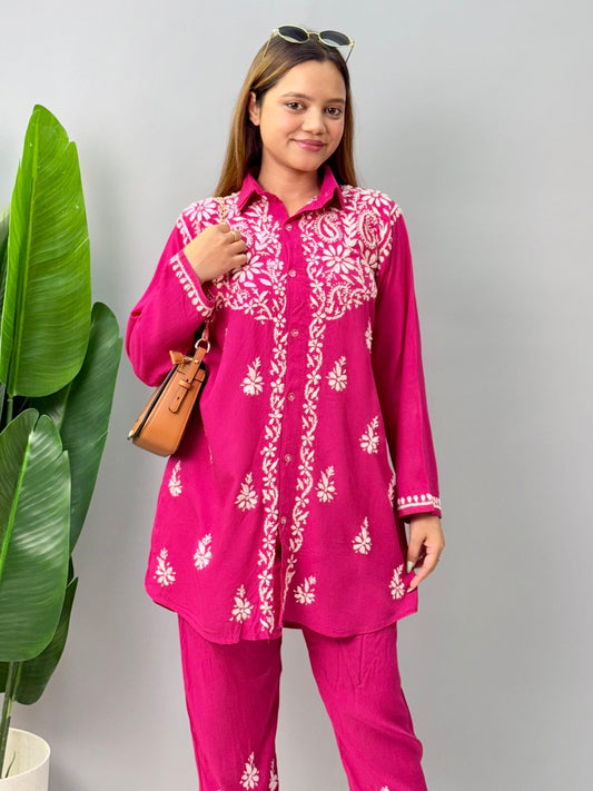 Woman wearing dark pink chikankari coord set with collared kurta and embroidered pants