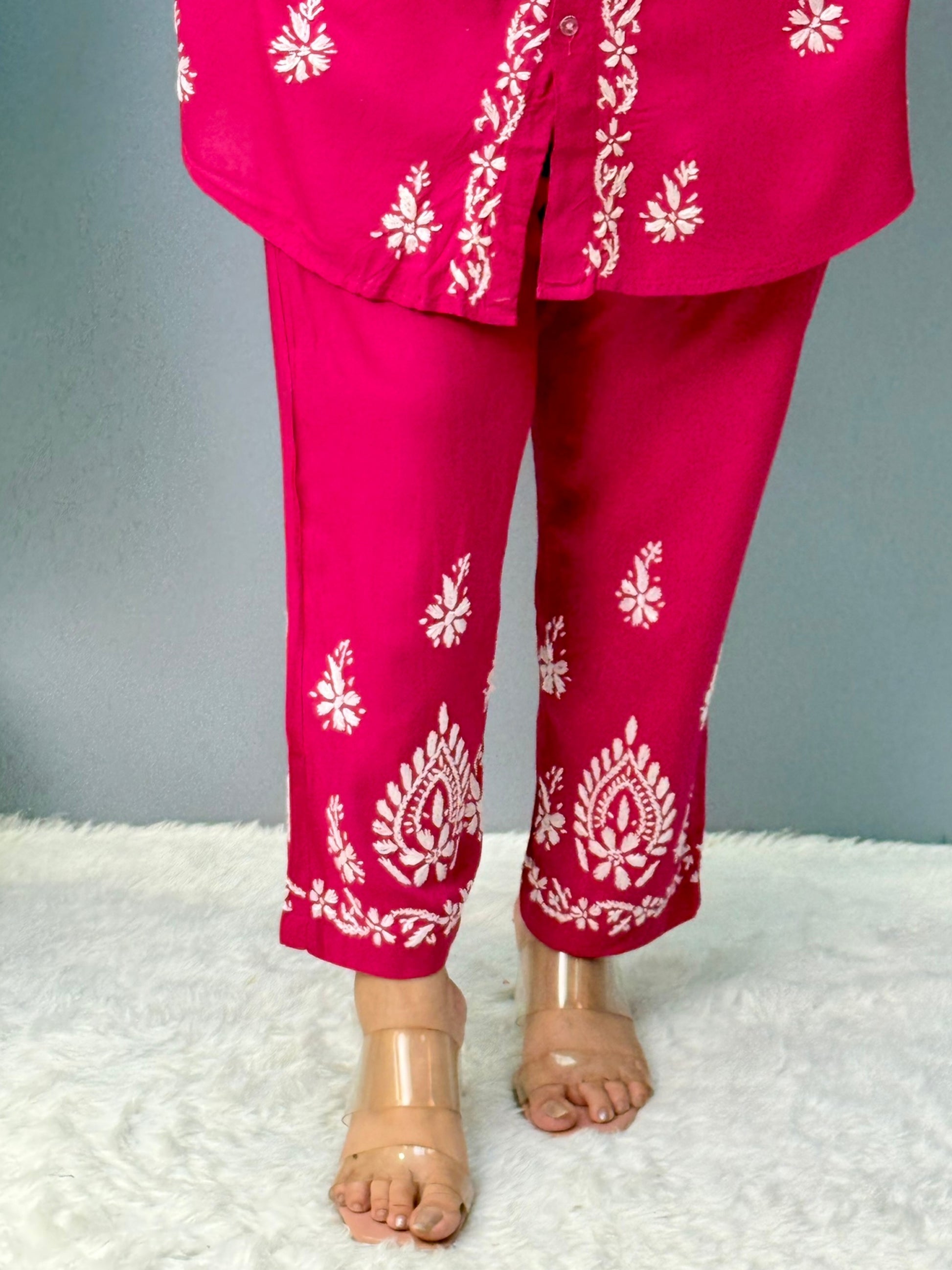 Woman wearing dark pink chikankari coord set with collared kurta and embroidered pants