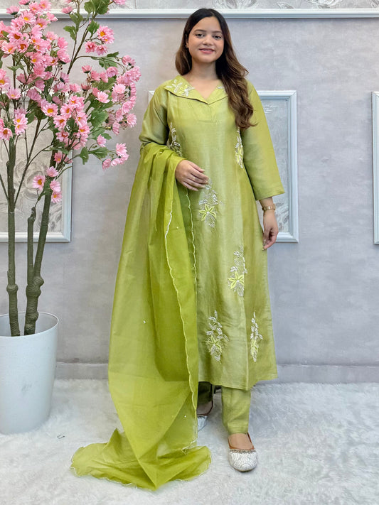 Model wearing an olive green tissue silk kurta with hand embroidery, paired with tissue silk pants and an organza dupatta – Designer Wear Collection.