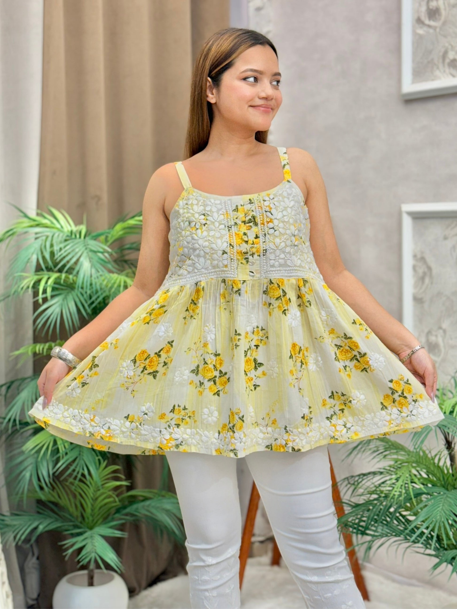 Yellow floral Chikankari short kurta in mulmul fabric with white embroidery and sleeveless design