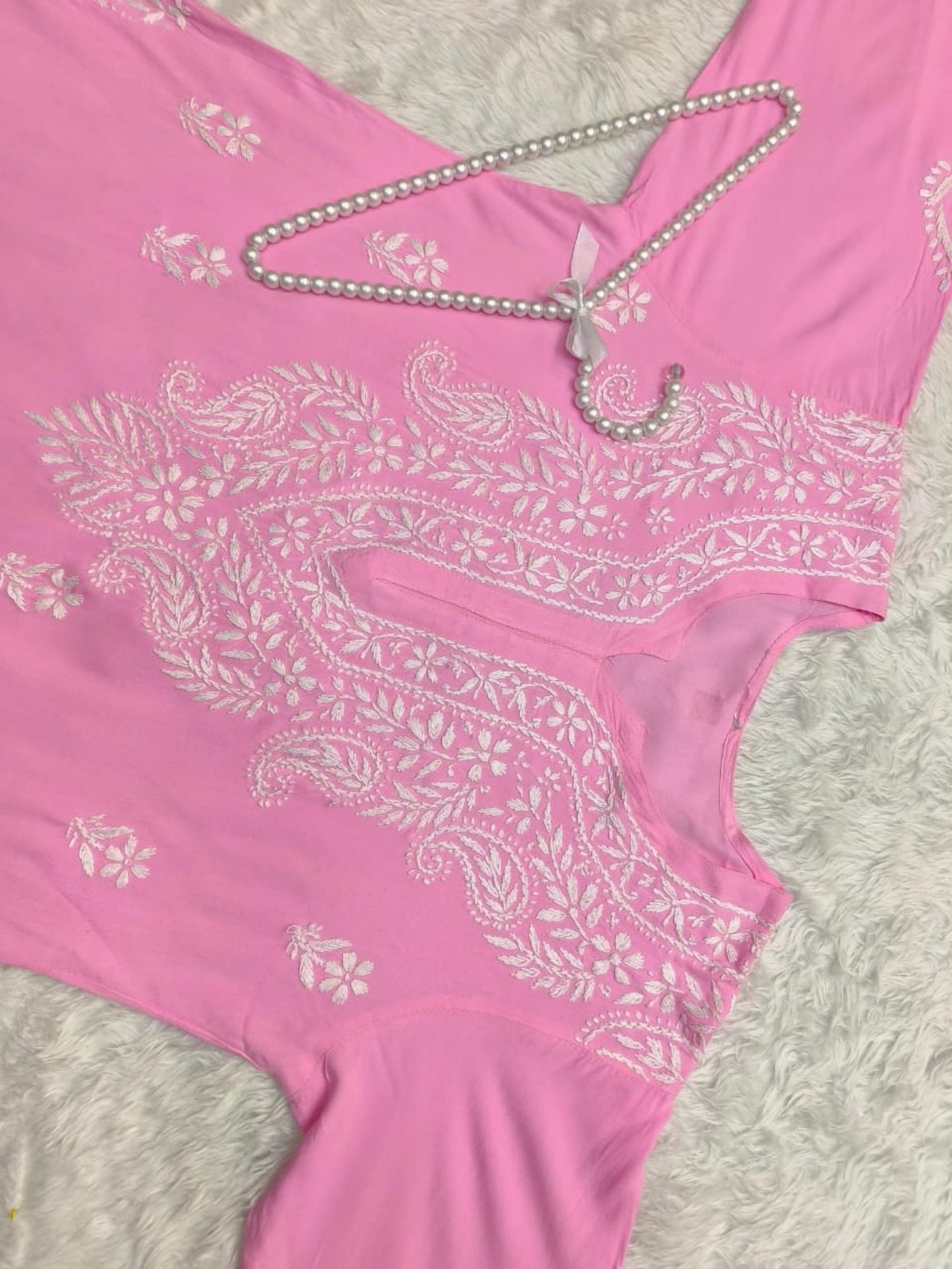 Pink rayon Lucknow chikankari kurta with hand embroidery – soft and comfortable.