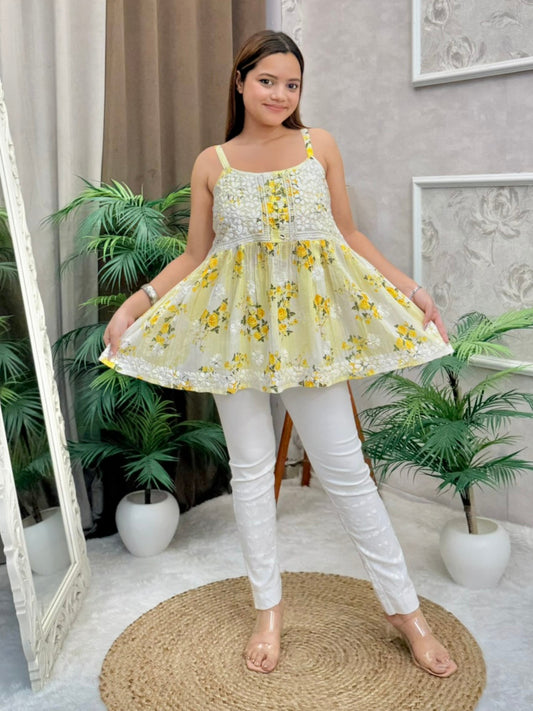 Yellow floral Chikankari short kurta in mulmul fabric with white embroidery and sleeveless design