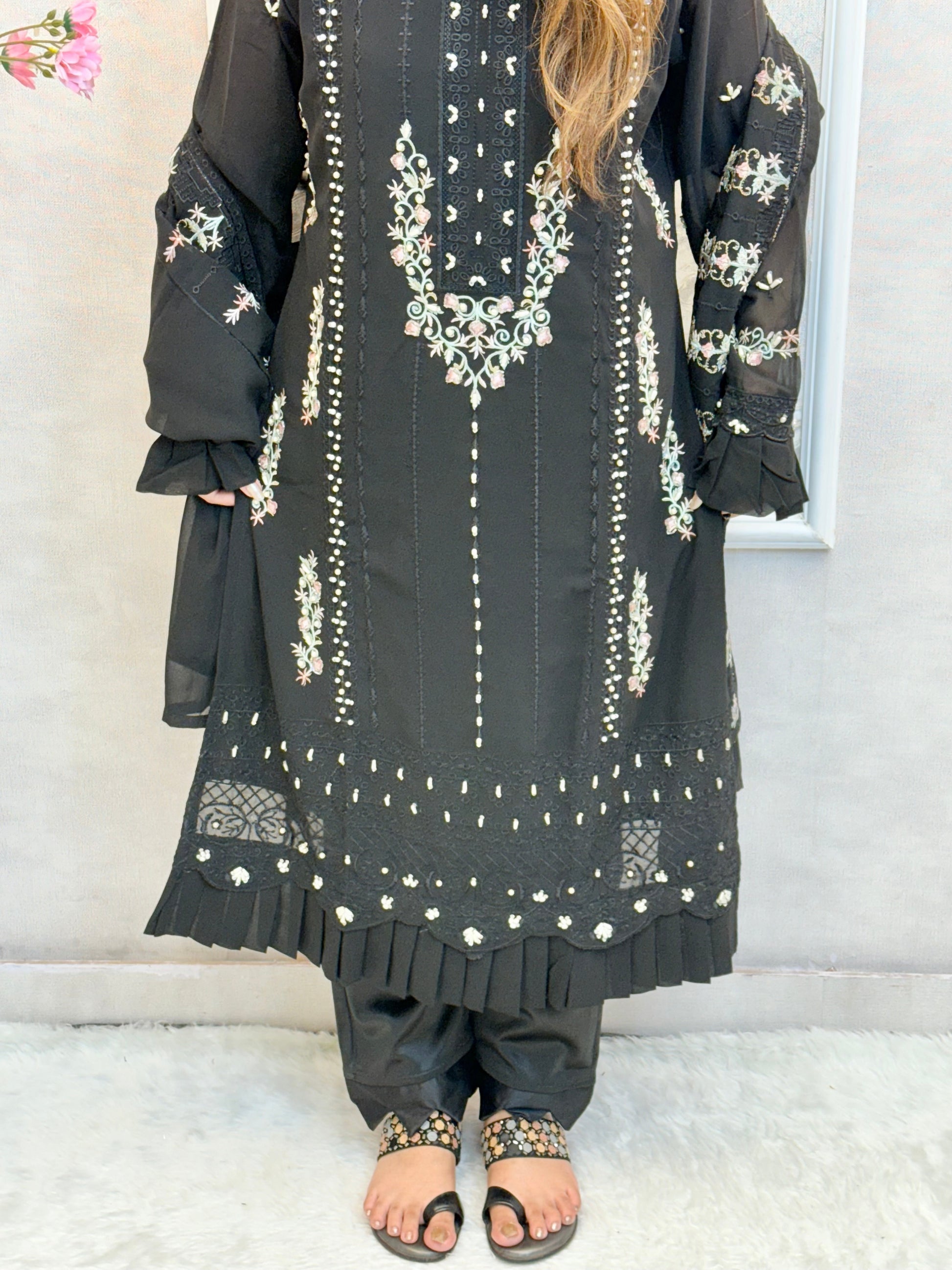 Model wearing a black embroidered georgette kurta with lycra stretchable pants and georgette embroidered dupatta – Designer Wear Collection.