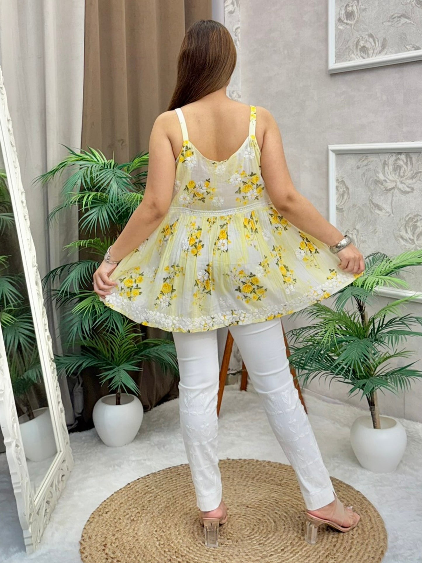 Yellow floral Chikankari short kurta in mulmul fabric with white embroidery and sleeveless design
