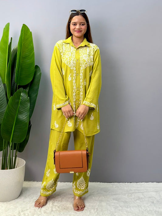 Woman wearing mustard lime chikankari coord set with embroidered kurta and pant
