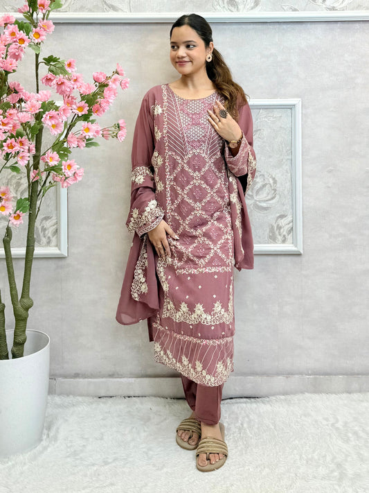 Model wearing a mauve georgette embroidered kurta with lycra stretchable pants and embroidered georgette dupatta – Designer Wear Collection.