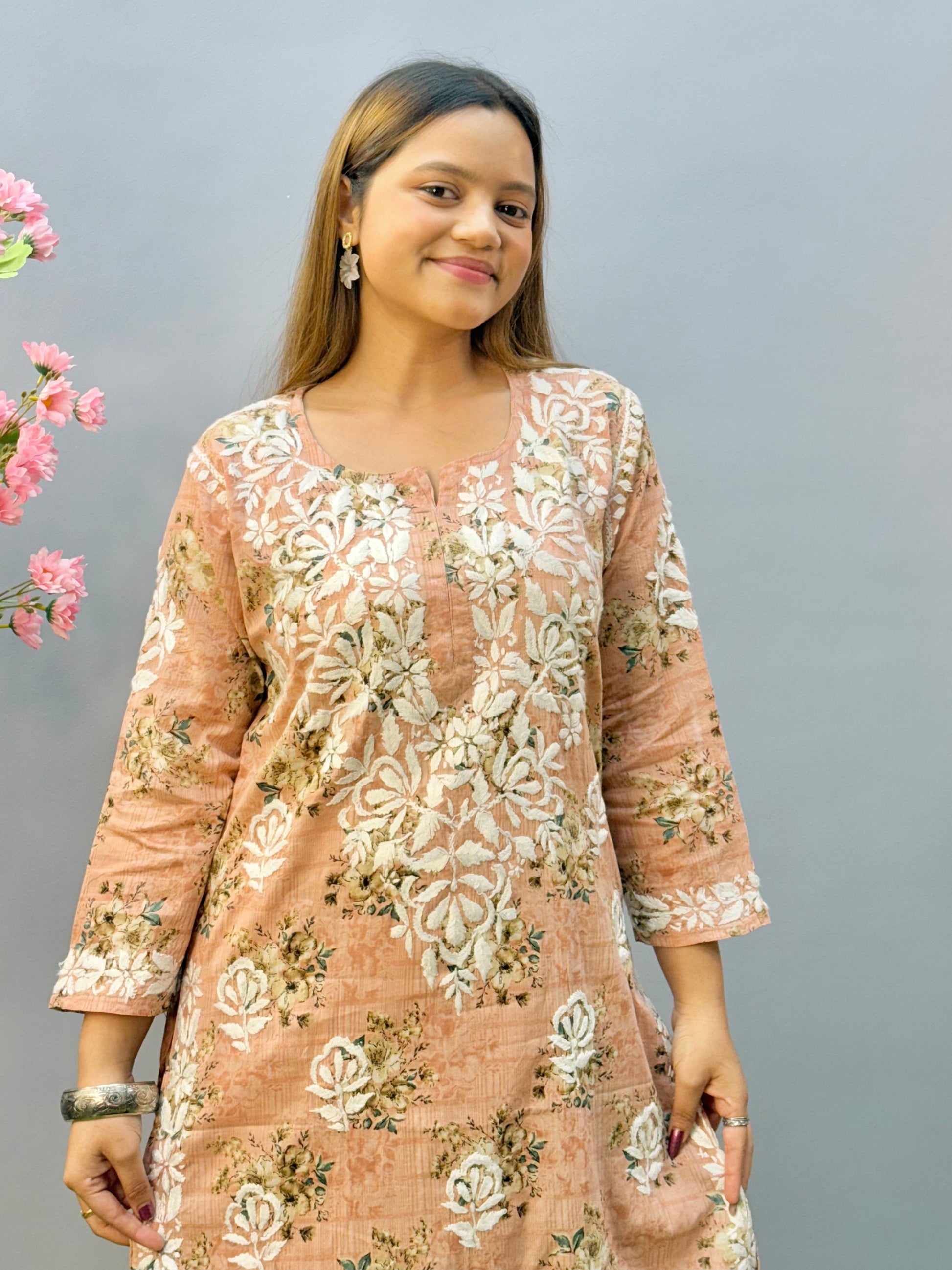 Warm peach printed Lucknow Chikankari mulmul kurta palazzo set with lace detailing