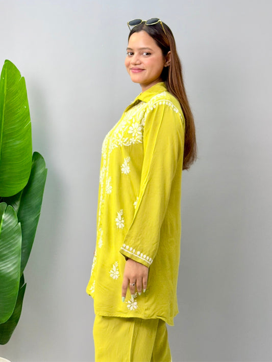 Woman wearing mustard lime chikankari coord set with embroidered kurta and pant