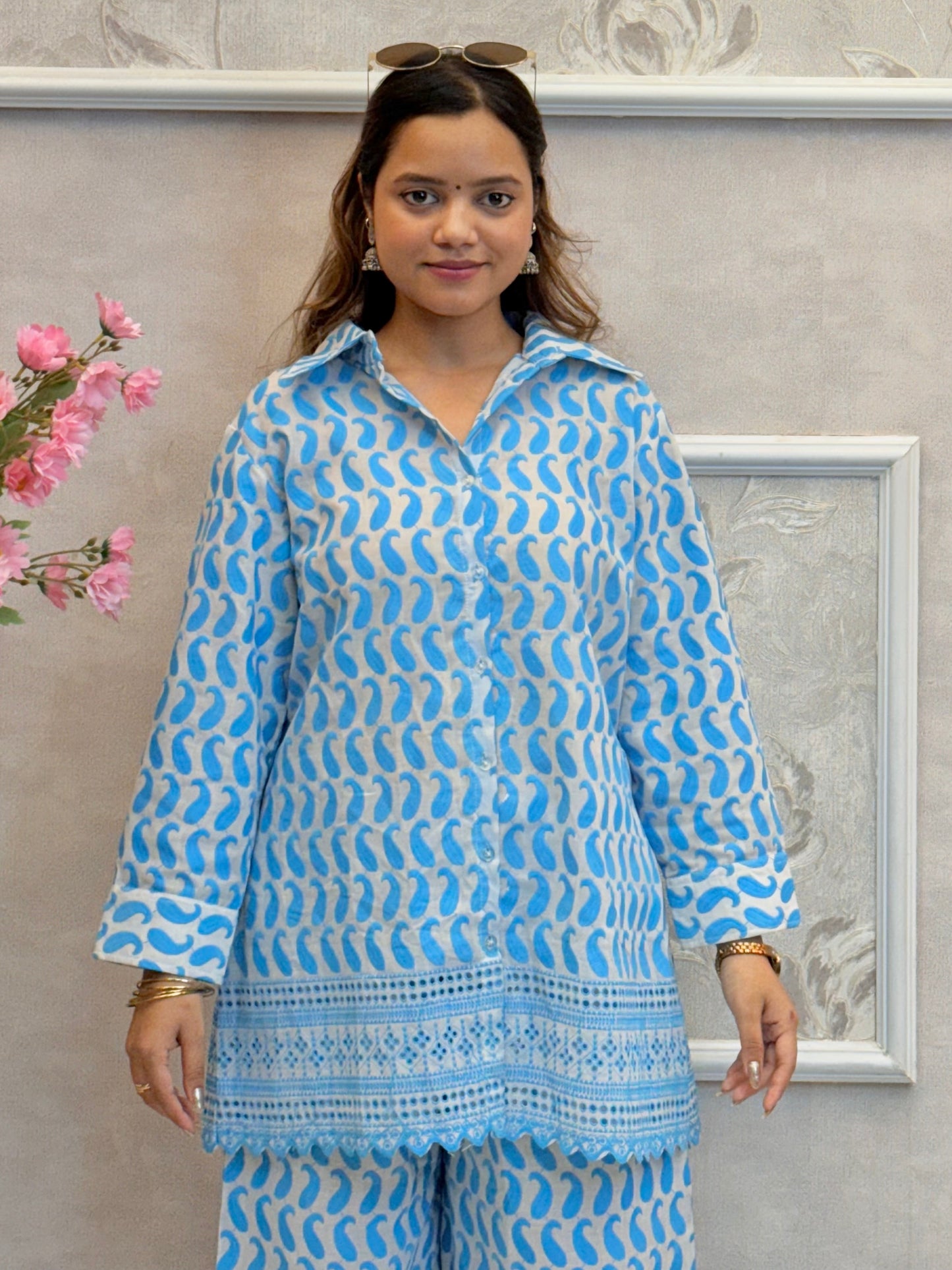 Model wearing a sky blue printed cotton co-ord set with fine machine work – kurta shirt and wide-leg palazzo pants – Designer Wear Collection.