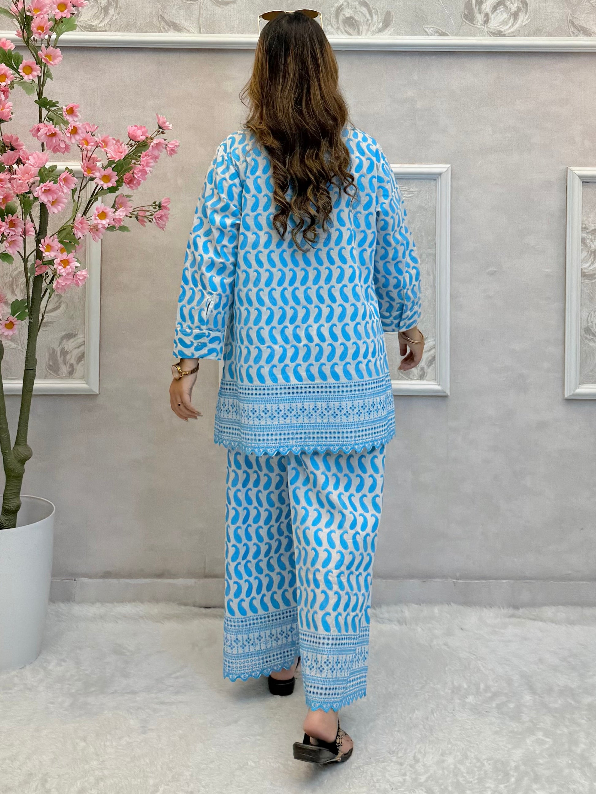 Model wearing a sky blue printed cotton co-ord set with fine machine work – kurta shirt and wide-leg palazzo pants – Designer Wear Collection.