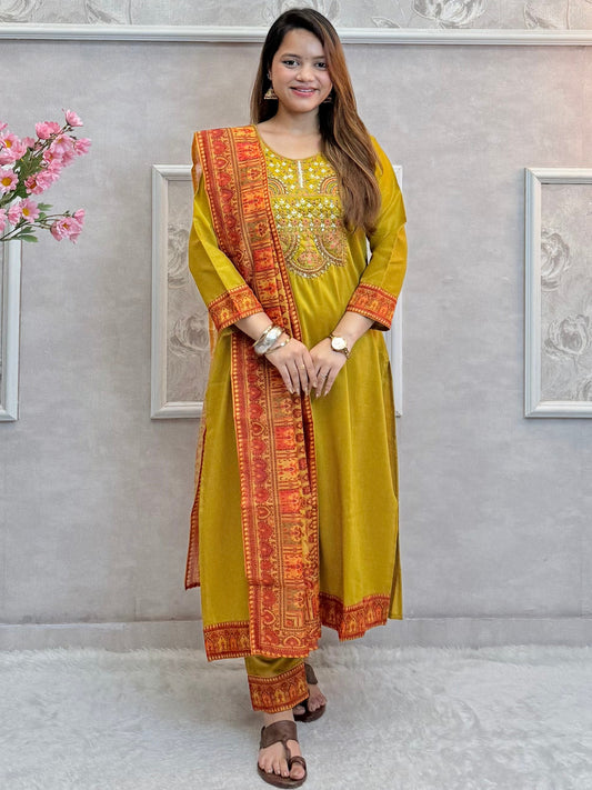 Model wearing a mustard yellow chanderi kurta with hand embroidery, paired with chanderi pants and a red-golden woven chanderi dupatta – Designer Wear Collection.