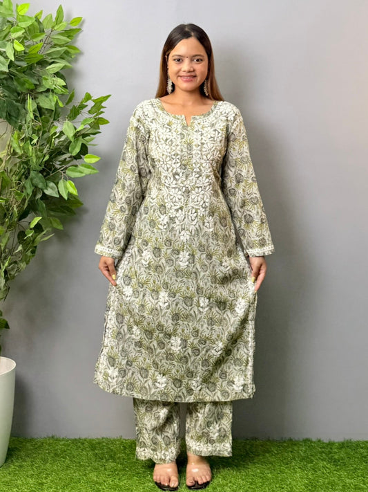Model wearing olive grey printed mulmul chikankari kurta and pant set