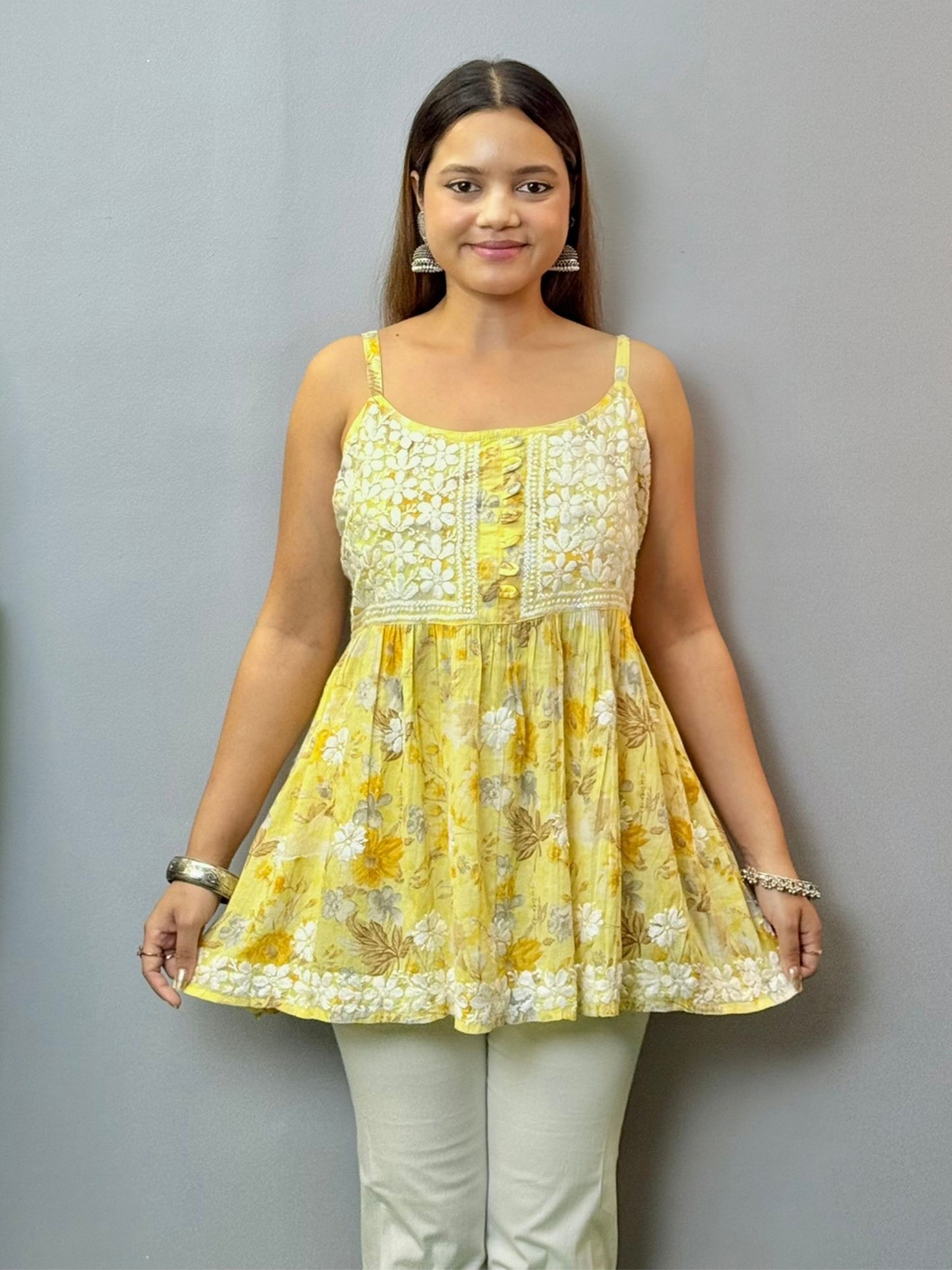 Mustard yellow floral printed mulmul chikankari short kurta with sleeveless straps and delicate hand embroidery