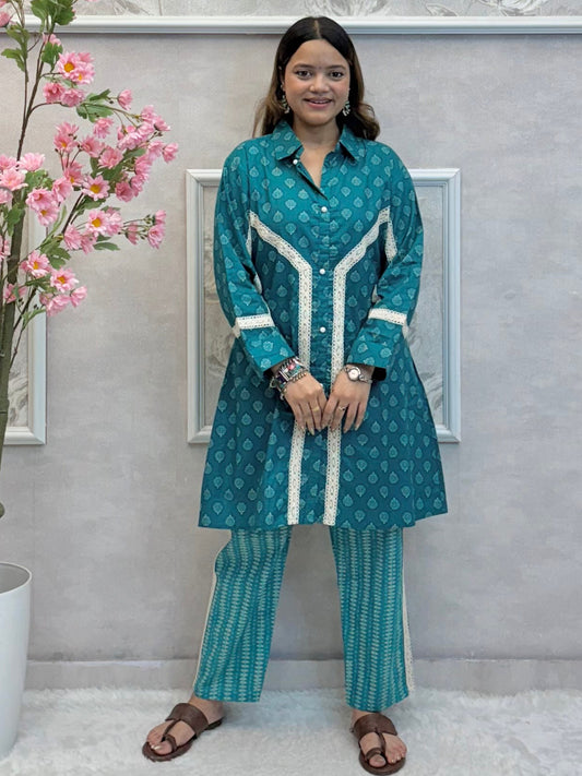 Model wearing a teal blue mulmul co-ord set with button-down kurta and printed straight pants – Designer Wear Collection.