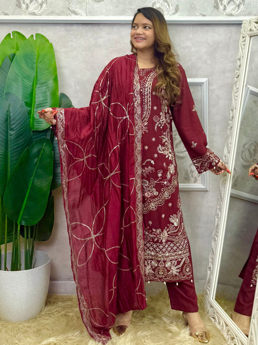 Model wearing a maroon rayon kurta with intricate machine embroidery, paired with rayon pants and a chanderi dupatta – Designer Wear Collection.