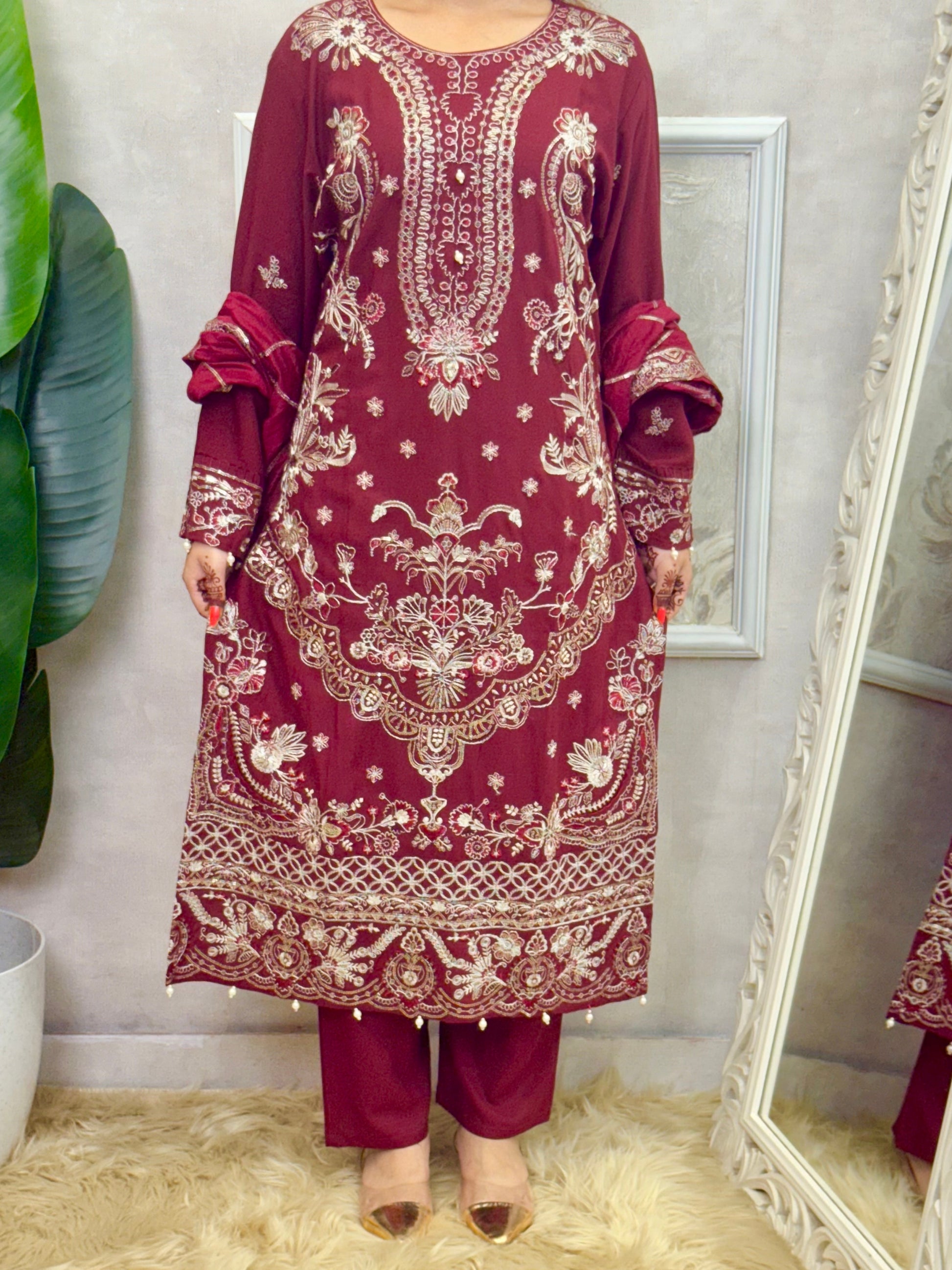 Model wearing a maroon rayon kurta with intricate machine embroidery, paired with rayon pants and a chanderi dupatta – Designer Wear Collection.