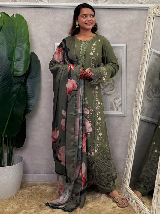 Model wearing an olive green rayon embroidered kurta with rayon pants and a floral printed georgette dupatta – Designer Wear Collection.