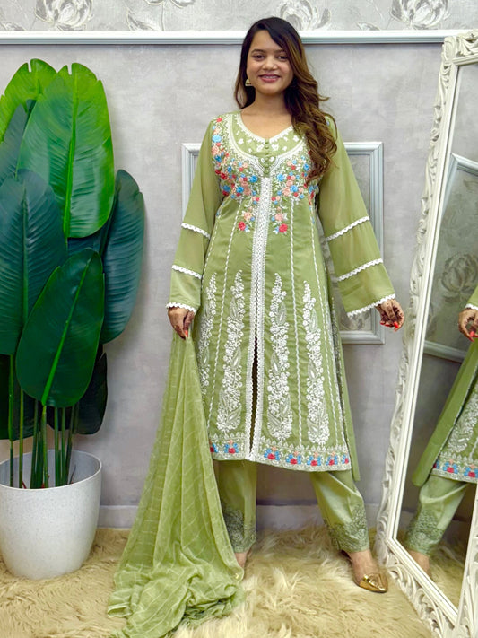 Model wearing a sage green embroidered georgette kurta with lycra stretchable pants and a chiffon dupatta – Designer Wear Collection.