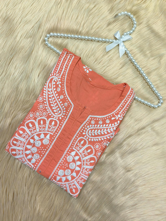 Rust cotton Lucknow Chikankari kurta with white embroidery and pearl hanger on fur background