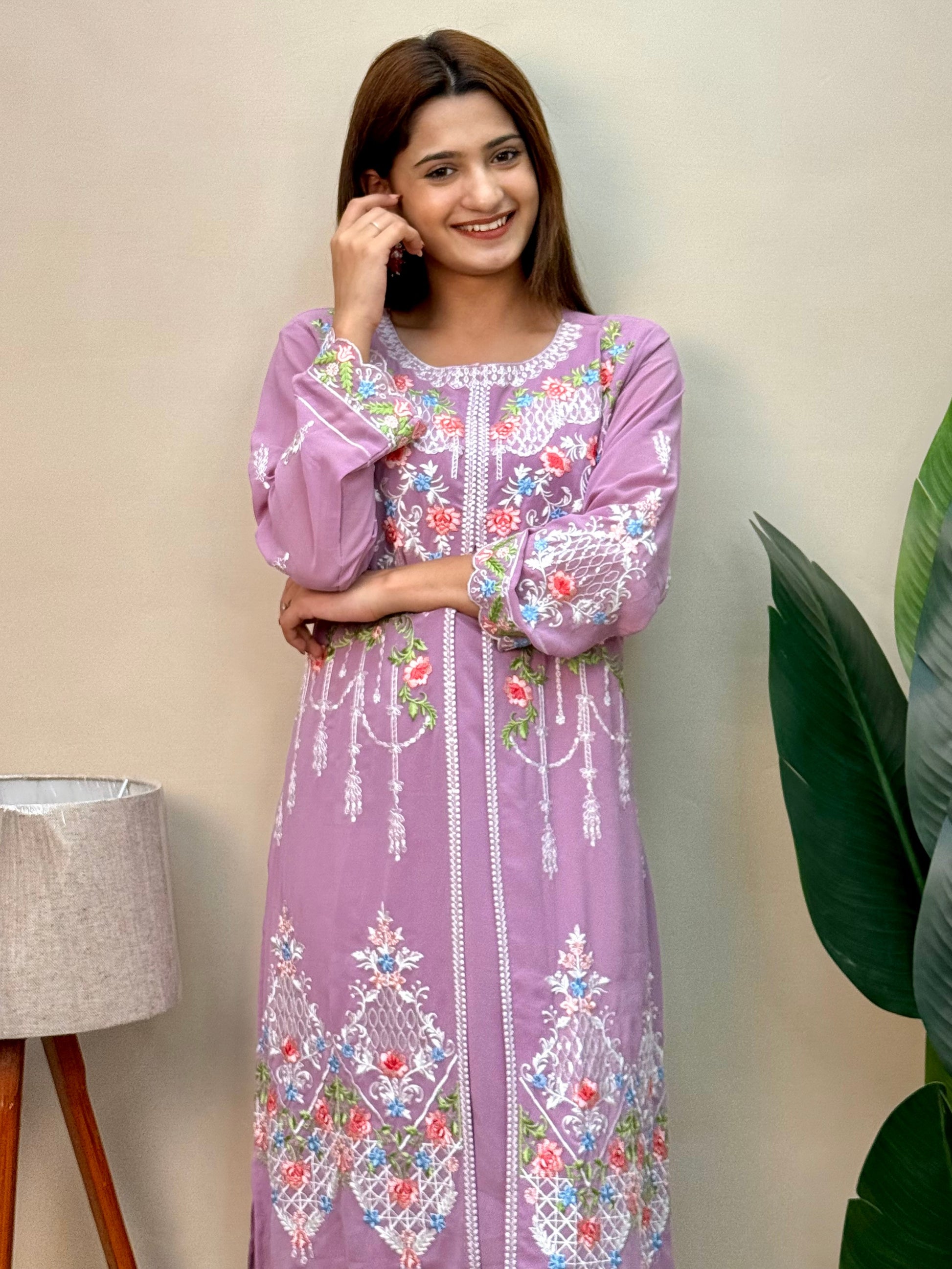 Model wearing a lavender georgette embroidered kurta with multicolor machine embroidery, paired with lycra stretchable pants – Designer Wear Collection.