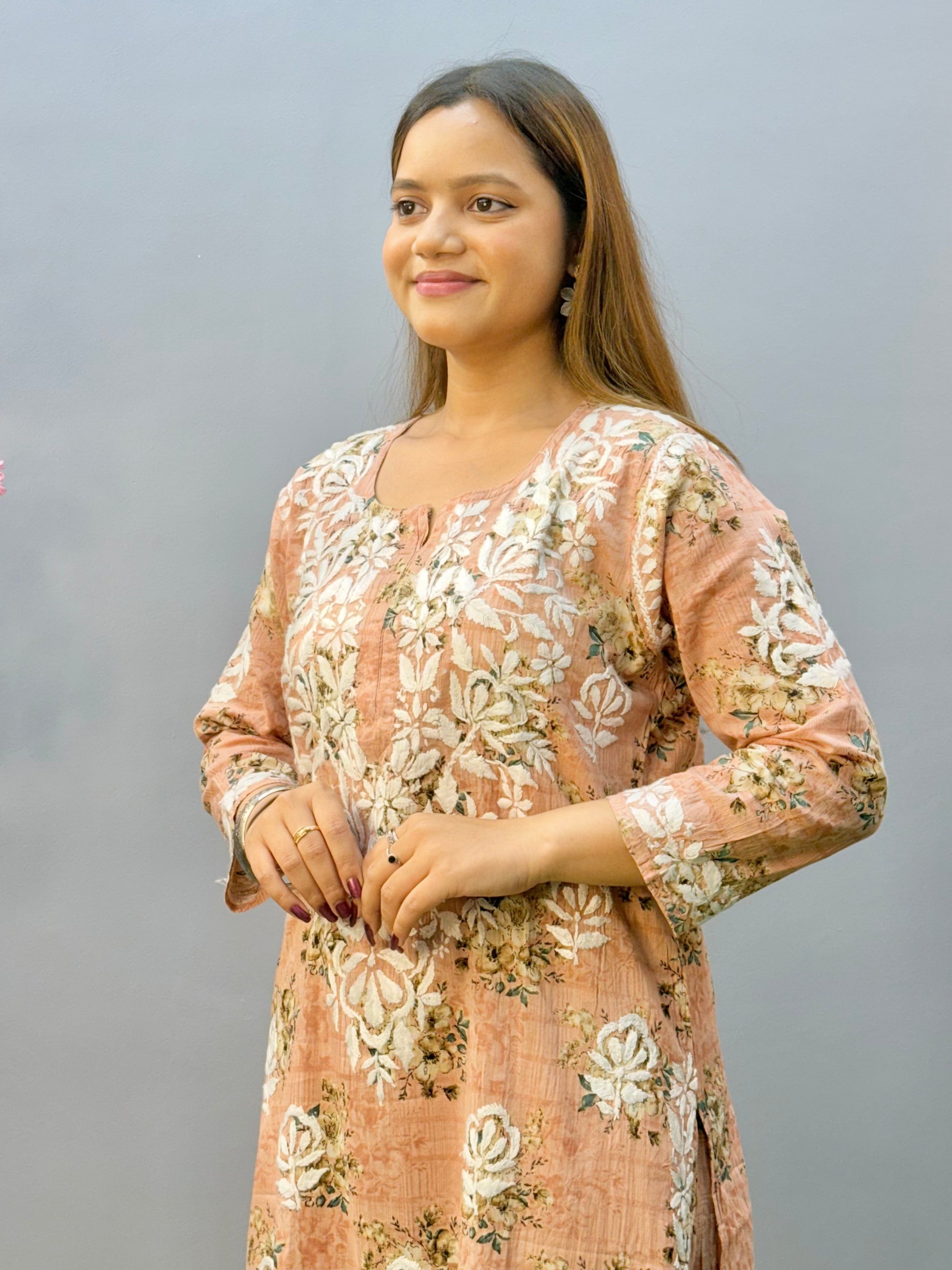 Warm peach printed Lucknow Chikankari mulmul kurta palazzo set with lace detailing
