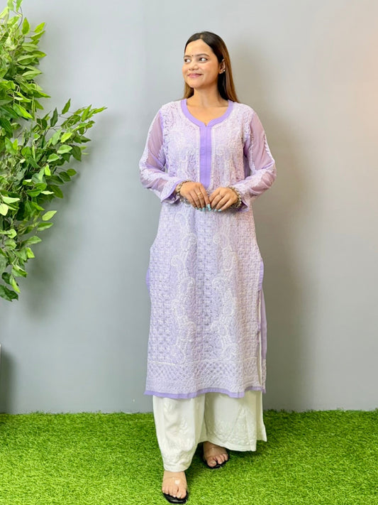 Model wearing a lavender translucent georgette Lucknowi chikankari kurta with heavy hand embroidery, styled with white palazzos for a festive look.