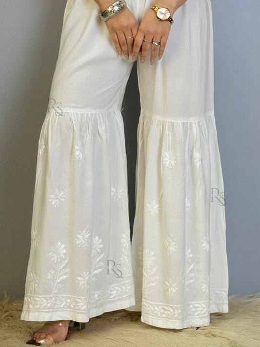 White modal chikankari sharara with flared hem and floral embroidery