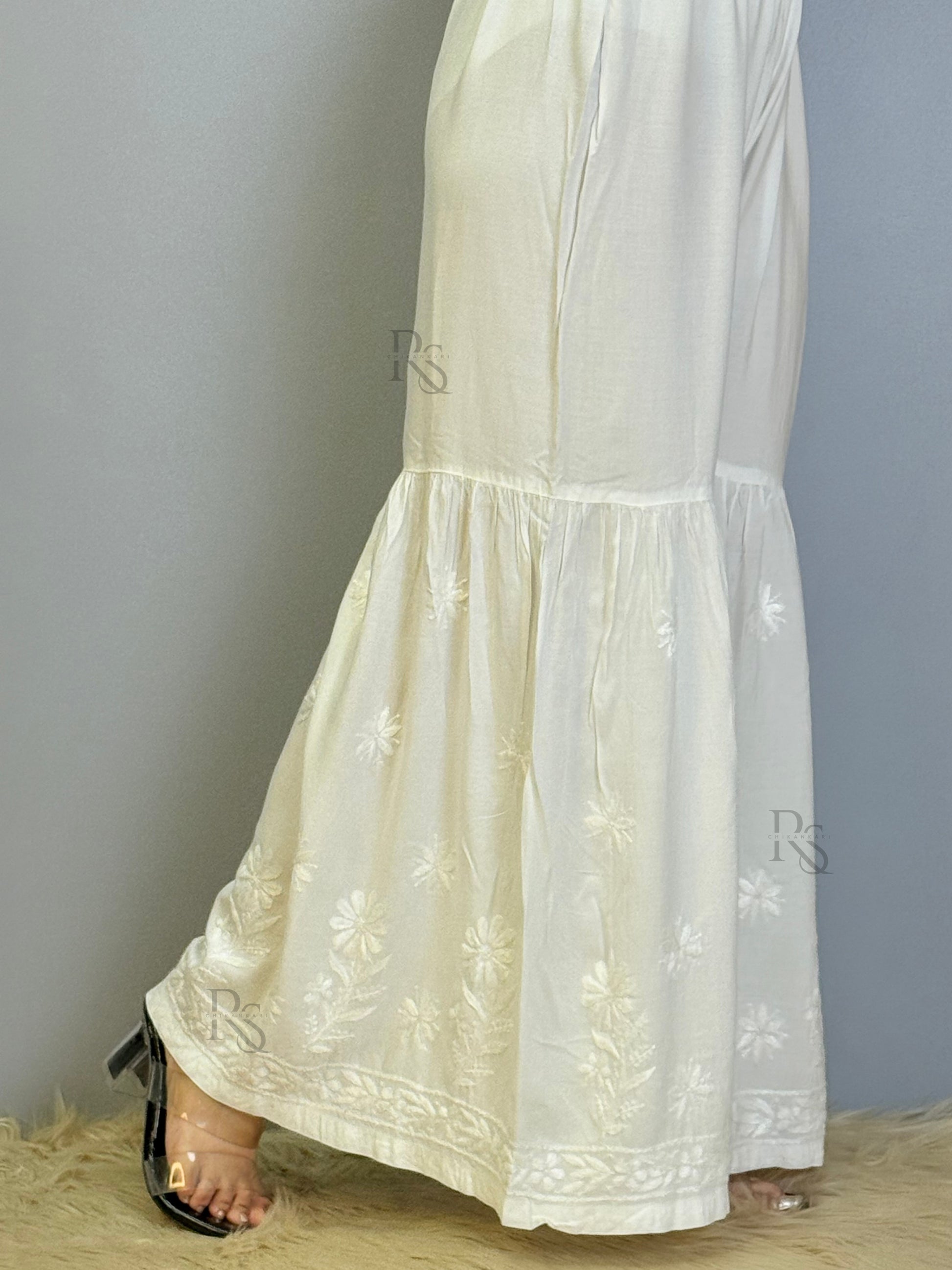 White modal chikankari sharara with flared hem and floral embroidery